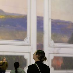 Museum of Art + Light - Visitors in the Mezmereyz 1 Gallery enjoying the immersive exhibition titled Renoir: A Luminous Evolution.