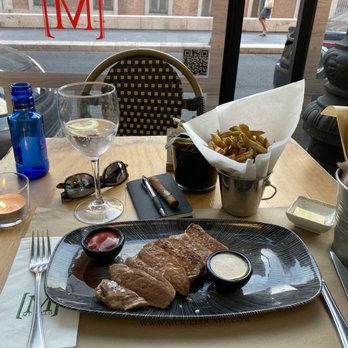 Cafe Murillo - Presa Iberica. Which is a tender, well-marbled cut found between the shoulder and loin of the Spanish Pata Negra pig. - Mediterranean Near Me - Madrid, M