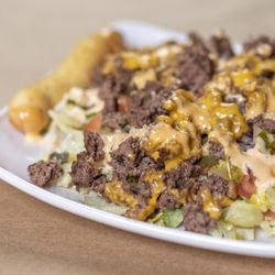 Old Nation Brewing Company - Benjamin Salad with shredded lettuce, local ground beef, red onion, tomato, chopped pickle, melted American cheese, and 1000 Island dressing