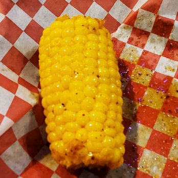 Lemon Butter Seafood - Chef trying a secret seasoning on corn for the menu - Seafood Near Me - Marietta, Georgia Lemon Butter Seafood - Chef trying a secret seasoning on corn for the menu - Seafood Near Me - Marietta, Georgia