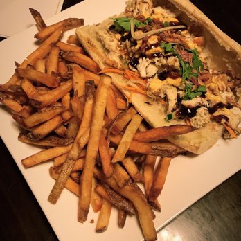 Underground Public House - Banh mi with chicken, on a French baguette, and a side of fries - American Near Me - Carbondale, Illinois Underground Public House - Banh mi with chicken, on a French baguette, and a side of fries - American Near Me - Carbondale, Illinois