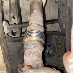 Pflum's Atascadero Muffler & Auto Sales - Close up of flex coupler 1989 BMW e30 325i.