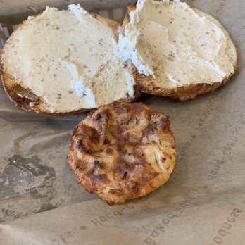 Einstein Bros. Bagels - Apple fritter bagel with Honey Almond schmear . Hashbrown on the side. - Bagels Near Me - Ormond Beach, Florida