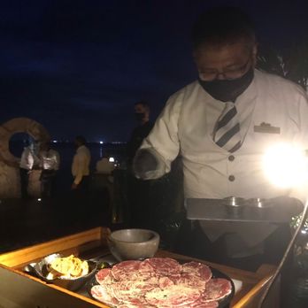Harry's - Juan placing the finishing touches on my Carpaccio. The best I've tasted yet! - Steakhouses Near Me - Cancún, ROO