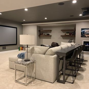 On The Level Contracting - a living room with a large screen - General Contractors Near Me - Chantilly, Virginia