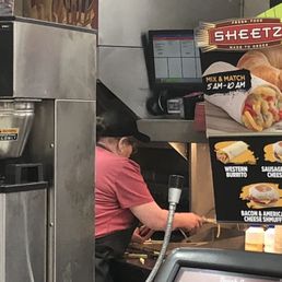 a man working in a fast food restaurant a man working in a fast food restaurant