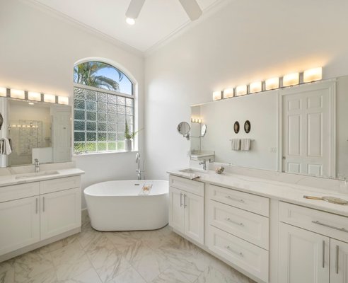 Photo of HN Kitchens By Design - Fort Lauderdale, FL, US. Complete Bath Remodel with new Mirror, Cabinets, Flooring, Tub and Sinks.