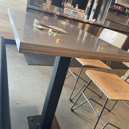 Disgusting dining area. Every table looked like this one. Disgusting dining area. Every table looked like this one.