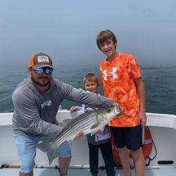 Shark Shark Tuna Fishing Charters - Captain Shane with striped bass and a strong crew of young anglers #riverviewbaitandtackle50thanniversary