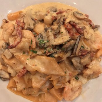 Villa Gennaro - Homemade roasted red pepper pasta with mushrooms, sun dried tomatoes, scallops and shrimp in a cream sauce - Italian Near Me - Edison, New Jersey Villa Gennaro - Homemade roasted red pepper pasta with mushrooms, sun dried tomatoes, scallops and shrimp in a cream sauce - Italian Near Me - Edison, New Jersey
