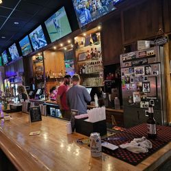 Community Inn Restaurant - The bar of the restaurant with many large screen TVs.