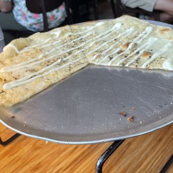 Ospi Venice - Detail of the paper thin crust on the Cacio e Pepe Pizza. - Italian Near Me - Venice, California Ospi Venice - Detail of the paper thin crust on the Cacio e Pepe Pizza. - Italian Near Me - Venice, California