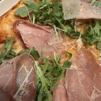 TABL M - Cured prosciutto and arugula flatbread, particularly eaten. - Mediterranean Near Me - Los Angeles, California TABL M - Cured prosciutto and arugula flatbread, particularly eaten. - Mediterranean Near Me - Los Angeles, California