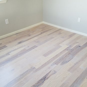 Uptown Flooring - a hardwood floor in a room - Flooring Near Me Uptown Flooring - a hardwood floor in a room - Flooring Near Me