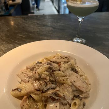 Taverna - Close-Up View of: my Paglia E Fieno dish, with Gluten-Free, rice-based ziti pasta substitute ($2.50 upcharge). Lavender Refresher cocktail - Italian Near Me - Austin, Texas Taverna - Close-Up View of: my Paglia E Fieno dish, with Gluten-Free, rice-based ziti pasta substitute ($2.50 upcharge). Lavender Refresher cocktail - Italian Near Me - Austin, Texas