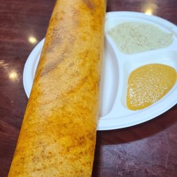 Dosa. Filled with potoes, onions and other tasty ingredients Dosa. Filled with potoes, onions and other tasty ingredients