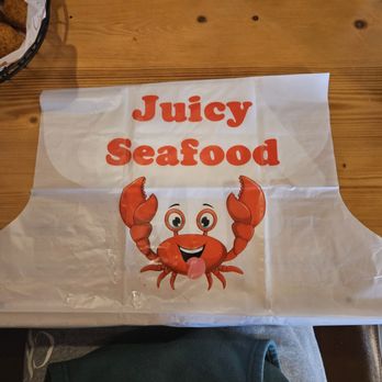 Juicy Seafood and Wings - Bib they provide for eating, they also give you gloves. - Seafood Near Me - Cleveland, Ohio Juicy Seafood and Wings - Bib they provide for eating, they also give you gloves. - Seafood Near Me - Cleveland, Ohio