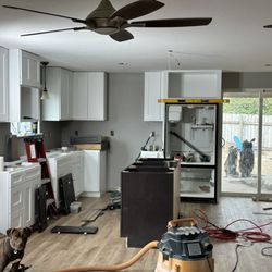 TCR Construction - Paint all done and cabinets are being installed (Don't mind the dog, she's my partner in crime!)