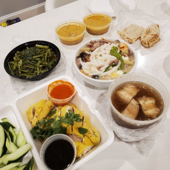 Penang - Left to right, back to front: Kang kung belacan, roti canai, clay pot pearl noodles in the center, hainanese chicken, and bak kut teh - Malaysian Near Me - Boston, Massachusetts
