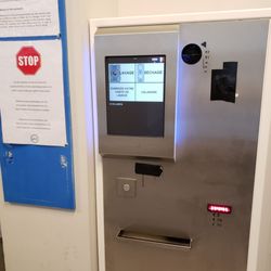Washing'ton - Automated machine. Seems to be a slot for coins and bills