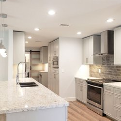 This kitchen features the Provincial Mitre Door Style by OMEGA Kitchen Cabinets.