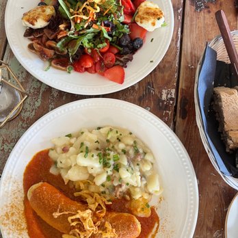 Siegfried's Restaurant - Curry brat w/ warm potato salad + salad w/ caramelized goats cheese - German Near Me - Sarasota, Florida Siegfried's Restaurant - Curry brat w/ warm potato salad + salad w/ caramelized goats cheese - German Near Me - Sarasota, Florida