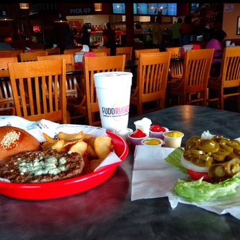 Fuddruckers - 2/3 Burger with blue-cheese before condiments, lettuce, tomato etc are added - Burgers Near Me - Miami, Florida Fuddruckers - 2/3 Burger with blue-cheese before condiments, lettuce, tomato etc are added - Burgers Near Me - Miami, Florida
