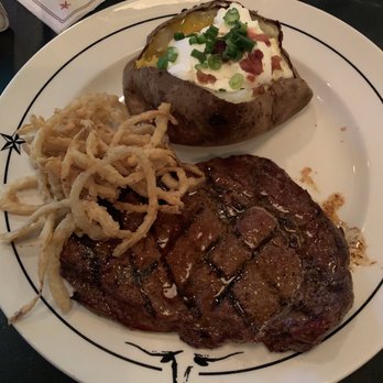 Saltgrass Steak House - 12 oz Pat's Ribeye* Onion strings, Baked Potato - Steakhouses Near Me - Katy, Texas Saltgrass Steak House - 12 oz Pat's Ribeye* Onion strings, Baked Potato - Steakhouses Near Me - Katy, Texas