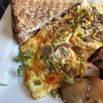 Keke's Breakfast Cafe - Do y'all see the sausage and mushrooms in this picture?  The insides was all cheese no sausage or mushrooms.   This is a 16$ omelette. - Breakfast & Brunch Near Me - Ormond Beach, Florida