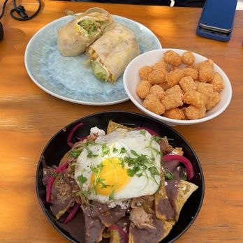 Toast Kitchen & Bakery - Thai chili chilaquiles, sisig burrito, side of tater tots - Breakfast & Brunch Near Me - Tustin, California Toast Kitchen & Bakery - Thai chili chilaquiles, sisig burrito, side of tater tots - Breakfast & Brunch Near Me - Tustin, California
