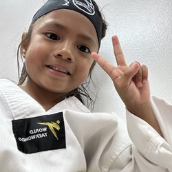 Charleston Taekwondo - Mount Pleasant - Mila loves wearing her taikwondo uniform to class.