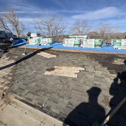 Nicholson Roofing - Two layers of roofing being removed.
