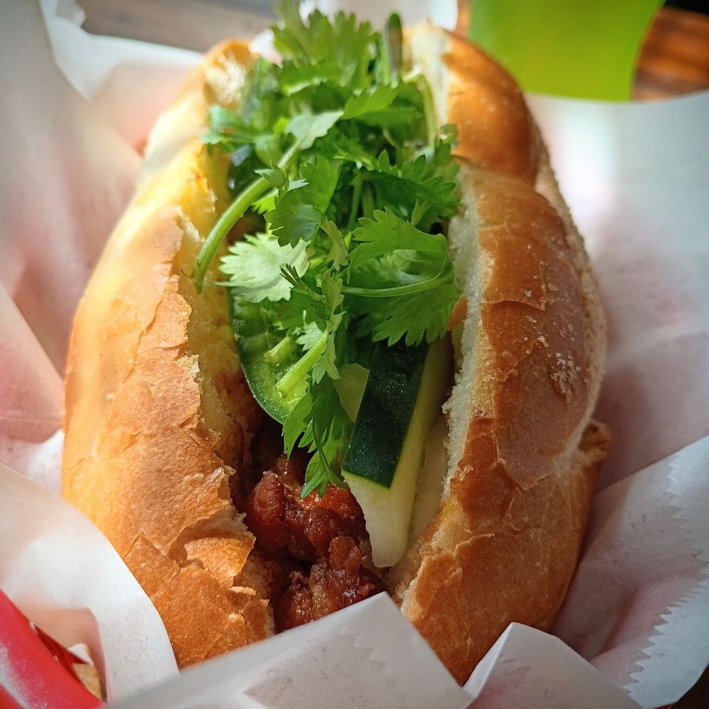 KKokio - Grilled pork banh mi. More like a char siu than a grilled pork in my opinion. But still tasty. Good bread. - Asian Fusion Near Me - Seattle, Washington KKokio - Grilled pork banh mi. More like a char siu than a grilled pork in my opinion. But still tasty. Good bread. - Asian Fusion Near Me - Seattle, Washington