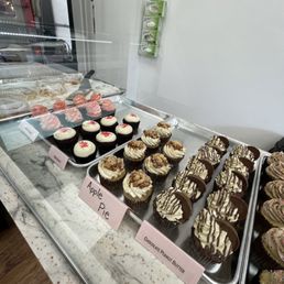 a variety of cupcakes on display