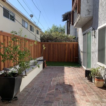 Monroe Masonry - New fence, new planter and capped seating area. Added a channel drain, and artificial turf. - Masonry/Concrete Near Me Monroe Masonry - New fence, new planter and capped seating area. Added a channel drain, and artificial turf. - Masonry/Concrete Near Me