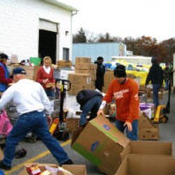 Medical Missionaries volunteers loading sea containers of supplies to be sent to those in need throughout the world