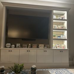 My Flippin' Family - Home entertainment built in with cabinets and lighted shelves.