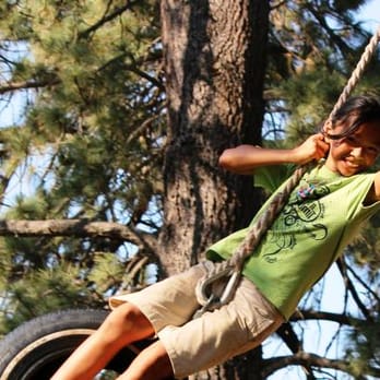 Pine Valley Bible Conference Center - A camper from SEP So Cal Youth Camp on the tire swing at the Pine Valley Bible Conference Center. - Summer Camps Near Me - Pine Valley, California Pine Valley Bible Conference Center - A camper from SEP So Cal Youth Camp on the tire swing at the Pine Valley Bible Conference Center. - Summer Camps Near Me - Pine Valley, California
