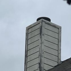 Chimney Sweep Specialists - I need repair to damaged vinyl trim or siding on the exterior of my chimney at the top roof.
