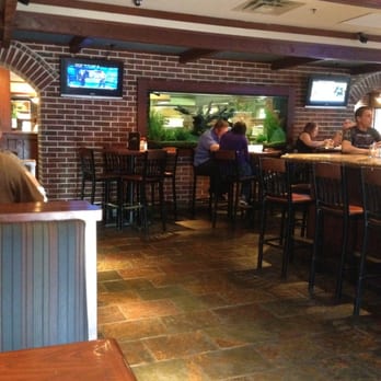 Cheddar's Scratch Kitchen - Picture from a booth in the bar, shows the huge fish tank - American Near Me - Saint Joseph, Missouri Cheddar's Scratch Kitchen - Picture from a booth in the bar, shows the huge fish tank - American Near Me - Saint Joseph, Missouri