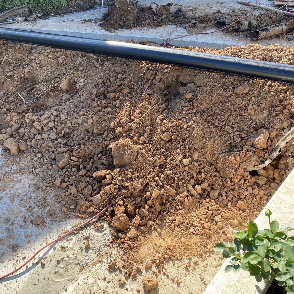 All Star Plumbing - One of two trenches cutting through driveway to the house/rental. Drain-o isn't gonna do it. - Plumbing Near Me