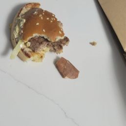 a half eaten hamburger on a table
