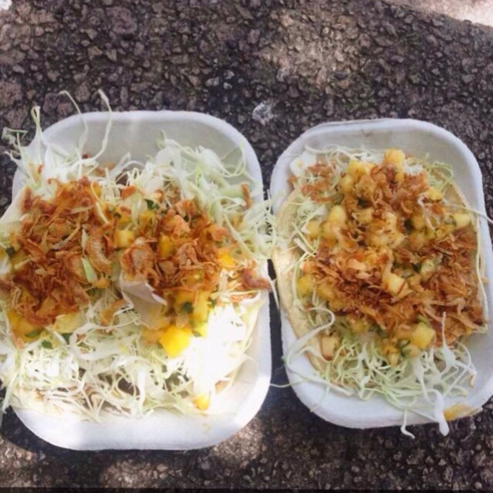 Two smoked chicken tacos and a pork jowl taco Two smoked chicken tacos and a pork jowl taco