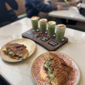 The Stockyard Coffeehouse - Queso con rajas on a croissant with a matcha flight - Coffee & Tea Near Me - Chicago, Illinois