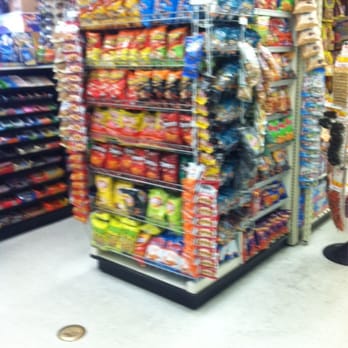Best Market - a woman standing in front of a display of snacks - Grocery Near Me - South Gate, California Best Market - a woman standing in front of a display of snacks - Grocery Near Me - South Gate, California