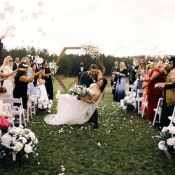 J. Major's Bridal Boutique - Bride celebrating in J. Major's Bridal Boutique Wedding Dress in Charlotte.