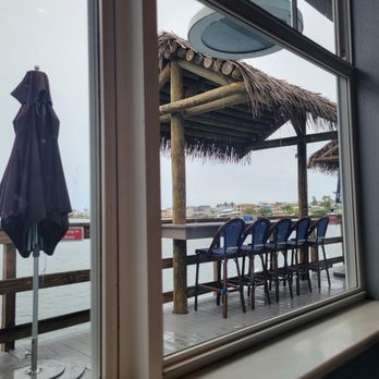 Anna Maria Oyster Bar - Pier - Window to outside. Rainy day - Seafood Near Me - Bradenton Beach, Florida