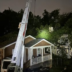 Tomahawk Tree Service - 24/7 Emergency Response. 12AM at night. Removing the tree to help prevent water damage to the home.