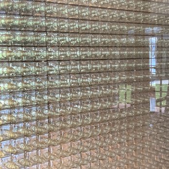 The Jack Daniel Distillery - Wall of Jack bottles. - Distilleries Near Me - Lynchburg, Tennessee The Jack Daniel Distillery - Wall of Jack bottles. - Distilleries Near Me - Lynchburg, Tennessee