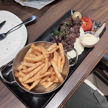 Paramount Fine Foods - a plate of french fries and steak - Middle Eastern Near Me - Milton, Ontario Paramount Fine Foods - a plate of french fries and steak - Middle Eastern Near Me - Milton, Ontario